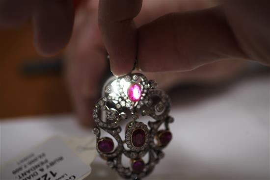An attractive early 20th century gold and platinum, ruby and diamond pendant brooch, overall 2.5in.